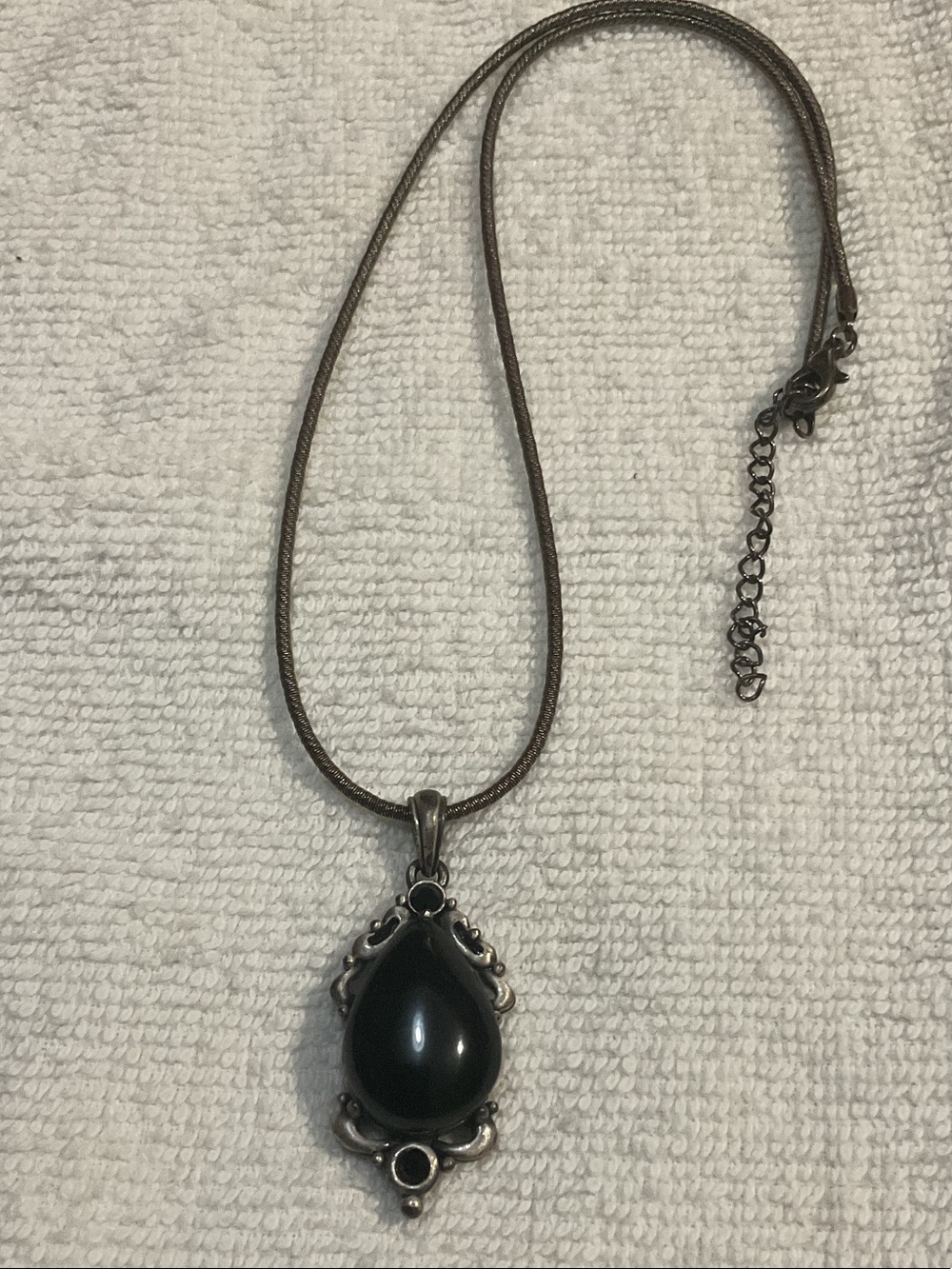 Black and silver pendant